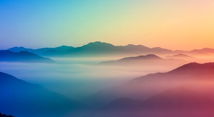 Obraz premium A breathtaking view of a mountain range shrouded in mist, with a vibrant gradient sky transitioning from blue to orange, creating a serene and majestic landscape