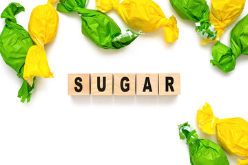 Text SUGAR on cubes on white black background Candy and the concept of fighting diabetes