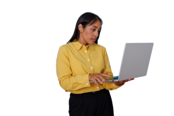 Businesswoman standing and working online, using a laptop, typing, focusing on digital tasks, transparent background