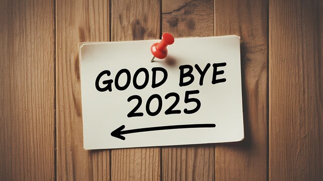 goodbye 2025 note pinned on wooden wall