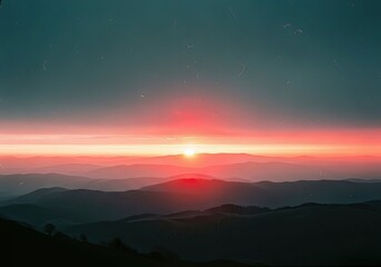 Stunning sunset over rolling mountain range, perfect for travel blog or wellness retreat, vibrant colors create peaceful nature scene, landscape photography