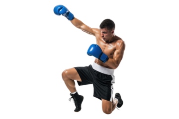 Kickboxer in blue gloves performing a dynamic flying superman punch