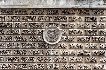 Textured brick wall with round pattern