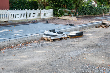 City road sidewalk repair with much pavement tiles, stones, sand.