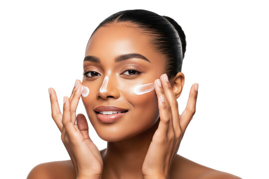 Happy African American woman applying stripes of sunscreen on her face for sun protection
