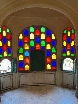 Colorful stained glass wall windows letting in colorful light