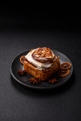 Cinnabon, a sweet cinnamon pastry, a high calorie bun or roll. Cinnabon with cinnamon