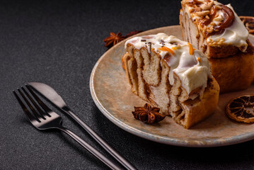 Cinnabon, a sweet cinnamon pastry, a high calorie bun or roll. Cinnabon with cinnamon