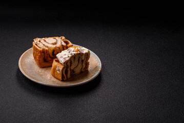 Cinnabon, a sweet cinnamon pastry, a high calorie bun or roll. Cinnabon with cinnamon