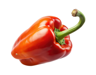 Beautiful vibrant red bell pepper against a stark black background, artistic photo