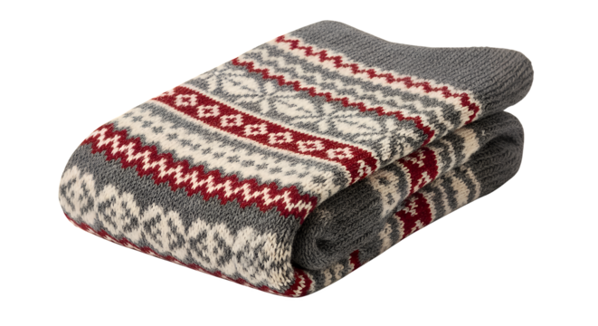 A cozy gray woolen throw blanket neatly folded to display its traditional red and white Scandinavian pattern, isolated on a transparent background
