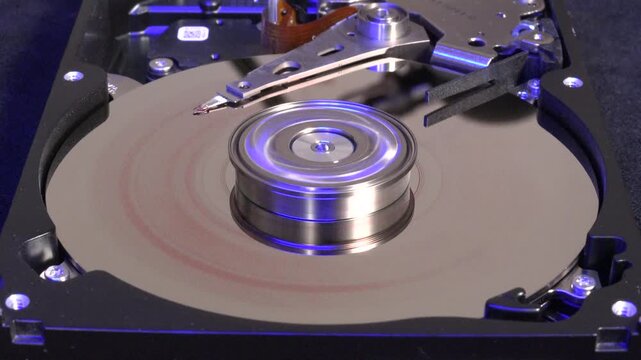 Open Hard Drive, Close-up View, Start Rotation and Erase the Word DATA, with Colorful Light Effects 