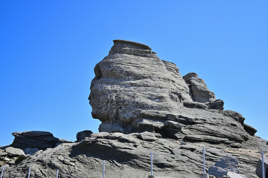 Natural Stone Sphinx of Bucegi Mountains Against Blue Clear Sky