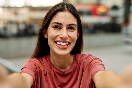 Young Woman Using Phone In A Subway Station