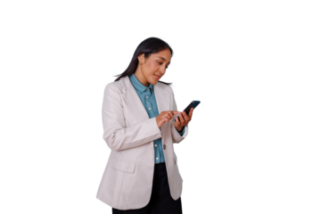 Young businesswoman using a mobile phone, texting, and browsing on an isolated transparent background