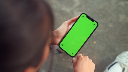 Hand of sports woman holding smartphone with green screen for copy space, mobile fitness app technology for health and workout training, space for advertising - Powered by Adobe