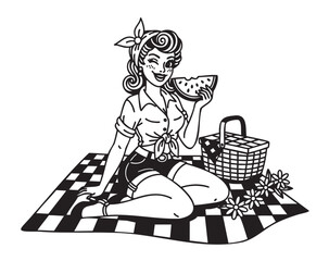 Young caucasian woman in vintage attire sits on a checkered picnic blanket, holding a slice of watermelon with a wicker basket and flowers beside her.