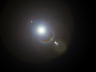 Bright Cinematic Lens Flare with Rainbow Spectrum Reflection on Black Background Realistic Optical Glow Light Effect