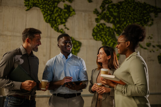Diverse business team collaborating during coffee break