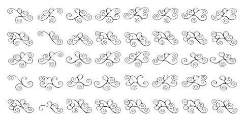 Collection of hand drawn black decorative ornamental swirls and flourishes on white background