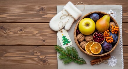 Assorted fruits and nuts in basket with Christmas decorations on wood  
