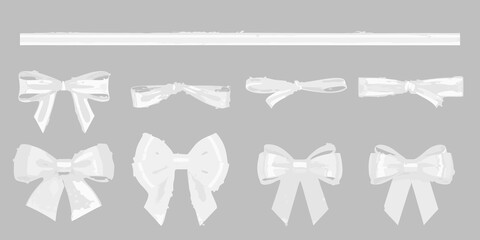 Collection of elegant white satin bows and ribbon elements on a neutral gray background