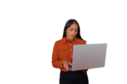 Professional woman standing while typing on laptop, working with technology and managing remote business tasks