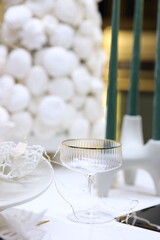 Elegant glassware and white decor create a charming atmosphere for a stylish gathering