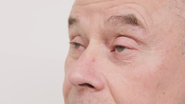 Close up mature senior man, fatigue syndrome eye Asthenopia, eye pain symptoms, including strain, allergies, blocked duct, severe eye conditions, corneal ulcers, glaucoma or acute angle-closure