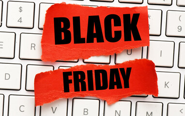 Black Friday words written on a piece of paper. Time for promotions and sales in stores.
