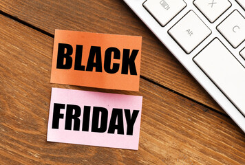 Black Friday words written on a piece of paper. Time for promotions and sales in stores.