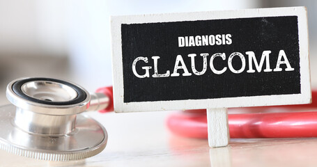 GLAUCOMA word on a small chalk board next to a stethoscope.