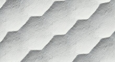 Close up of a textured surface with repeating geometric hexagonal patterns in grayscale
