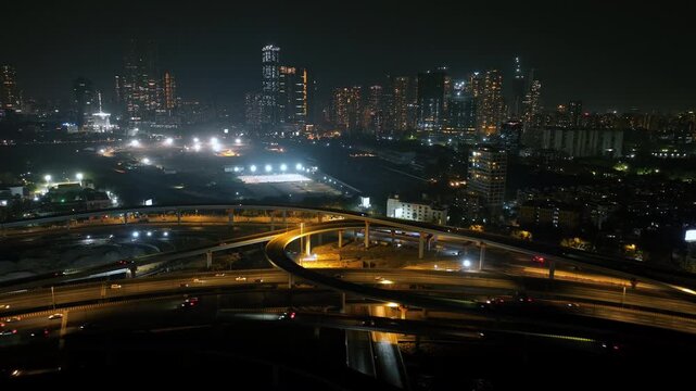 Morning view of the Mumbai Coastal Road in Maharashtra, India, famously known as the 'City of Dreams.' The scene captures a multileveled interchange roadway. A complex road network and urban designs.