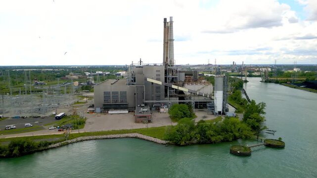 Aerial view of DTE Energy river rouge power plant along Detroit river in Michigan for industrial power generation.