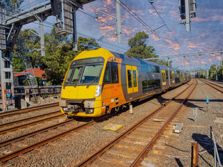 Fototapeta premium Passenger Train going through Summer Hill train station a suburban Sydney train Station NSW Australia