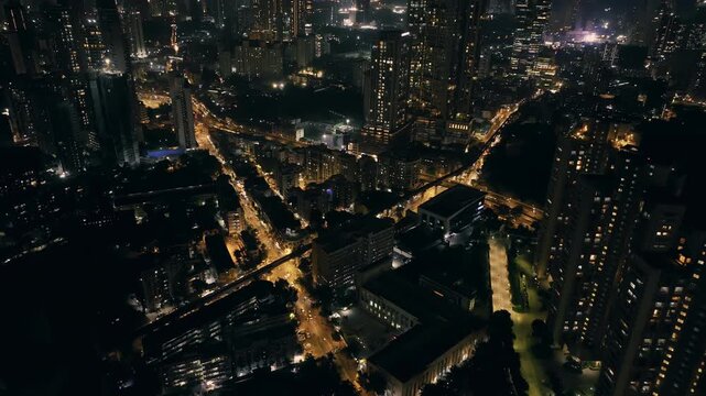Cinematic aerial view of Mumbai's downtown night scene. Central Mumbai's cityscape and skyline- Lalbaug-Parel, Worli, Prabhadevi. beautiful modern buildings, bright glowing lights, and roads.