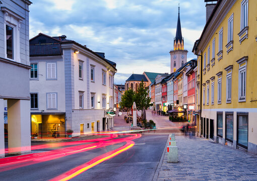 Long exposure of Villach paved street at dusk with light trails,