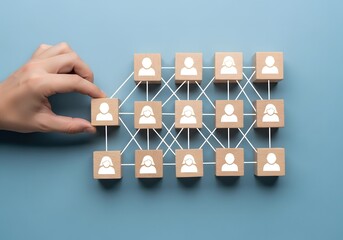Building a strong team, wooden blocks and people icons linked by gentle lines on a sky blue background, Human resources and management concept. 