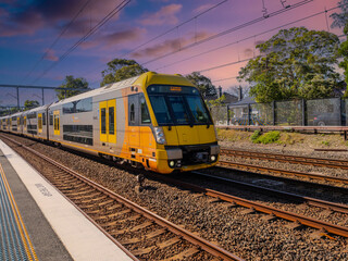Obraz premium Passenger Train going through Summer Hill train station a suburban Sydney train Station NSW Australia