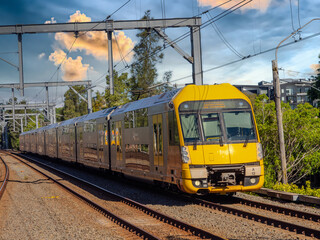 Obraz premium Passenger Train going through Summer Hill train station a suburban Sydney train Station NSW Australia