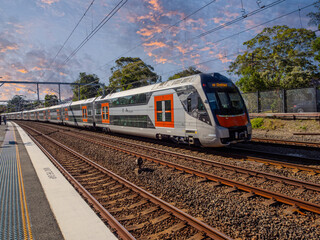 Obraz premium Passenger Train going through Summer Hill train station a suburban Sydney train Station NSW Australia