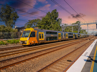 Fototapeta premium Passenger Train going through Summer Hill train station a suburban Sydney train Station NSW Australia