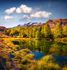 Colorful autumn view of Grindjisee lake, Switzerland, Europe. Stunning morning scene of Swiss Alps, Zermatt resort location. Beauty of nature concept background.