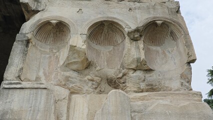 Rome, Italy – 11 January 2025. Close-up of three blocked niches with scalloped conches on the Arch of Janus, showing breakage and infill repairs to the original carving.
