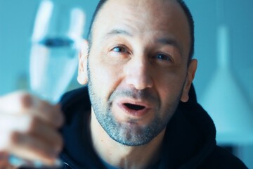 Man with champagne, celebrating a special occasion with a glass of fizz in hand, smiling brightly. Celebrating special occasion is a moment of joy and success, enjoying refreshing champagne.