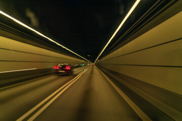 Driving through illuminated tunnel in South Sweden