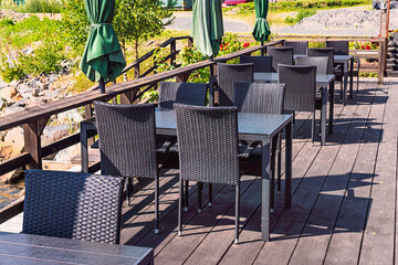 Axmar outdoor restaurant deck with empty tables and chairs