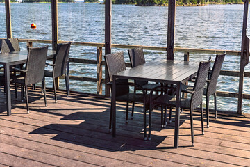Empty outdoor restaurant tables welcoming guests in Axmar, Sverige