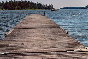 Wooden pier extending into tranquil Axmar bay